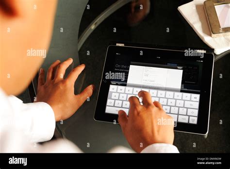 inputting information   tablet computer stock photo alamy