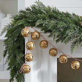 a christmas garland with bells hanging from it