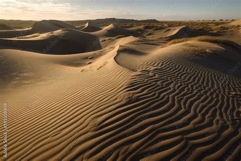 sand dunes in shifting and constantly changing patterns with the wind ...