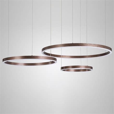 Three Circular Lights Hanging From The Ceiling