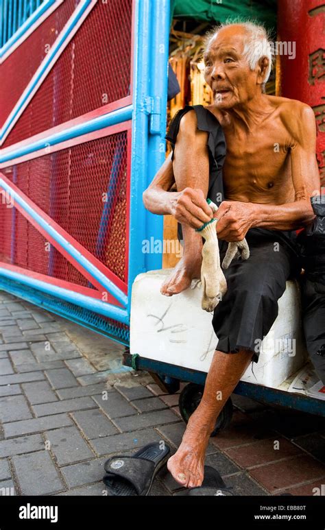 Hong Kong An Old Half Naked Man Near The Jade Market Stock Photo Alamy