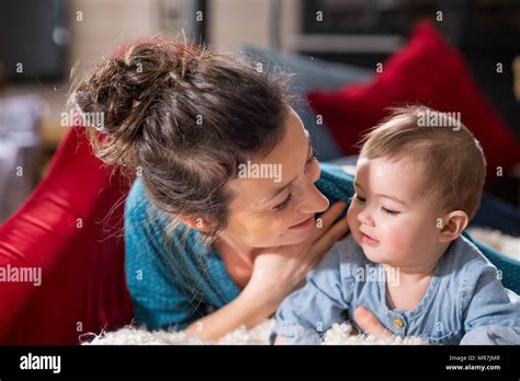 Mommy plays with her cheerful baby at home Stock Photo - Alamy