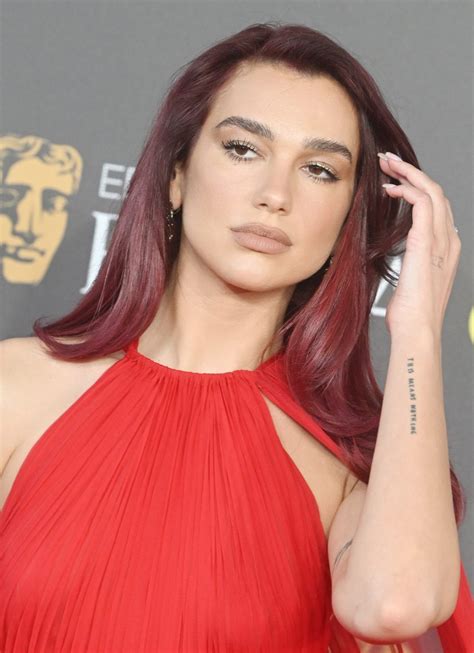 Red Haired Radiance Dua Lipa Makes Dramatic Entrance In Fiery Hot Valentino Gown At BAFTA Film