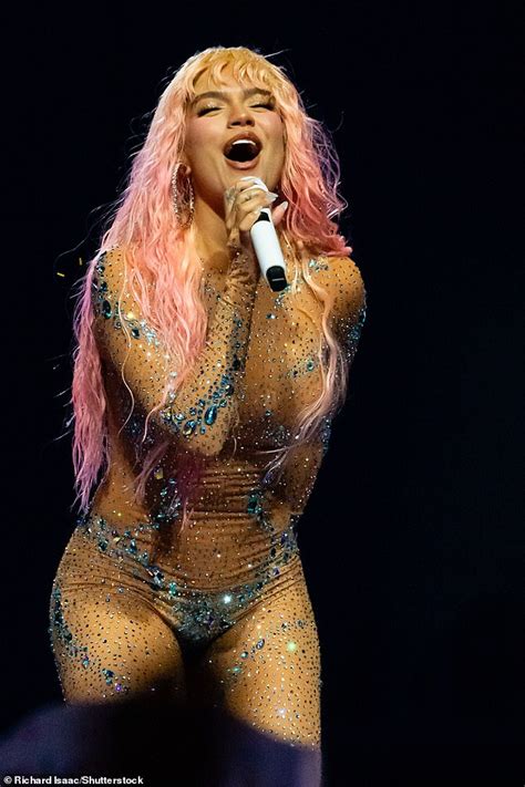 Karol G Flaunts Her Jaw Dropping Figure In A Dazzling Nude Catsuit As She Performs At The O