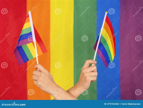 Hands Holding Colorful Rainbow Gay Flag Symbol Of Lgbt People Diversity Of Genders Love