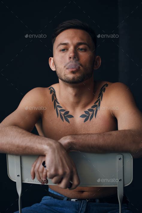 Modelling Snapshots Pensive Serious Tanned Attractive Handsome Naked Man Sit On Chair Smoking