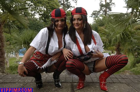Two Hot Girls Showing Their Nice Figures In Uniforms Photos