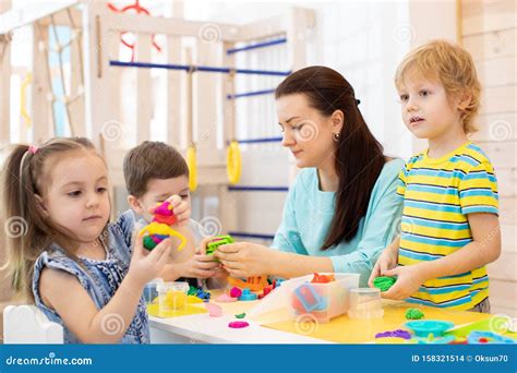 Kids with Play Clay Toys in Kindergarten Stock Photo - Image of people