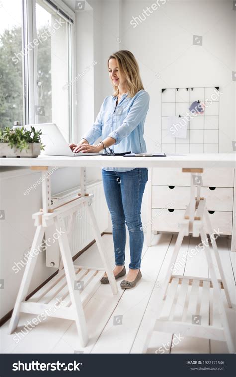 69,500 Woman Working Stand Desk Images, Stock Photos, 3D objects, & Vectors | Shutterstock