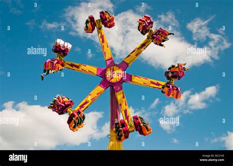 Rotating fun scary fairground ride Stock Photo - Alamy