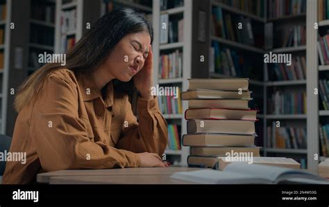 Tired Unwell Young Korean Woman Student Preparing For Exam In