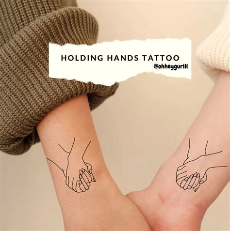 Two Hands Holding Each Other Tattoo