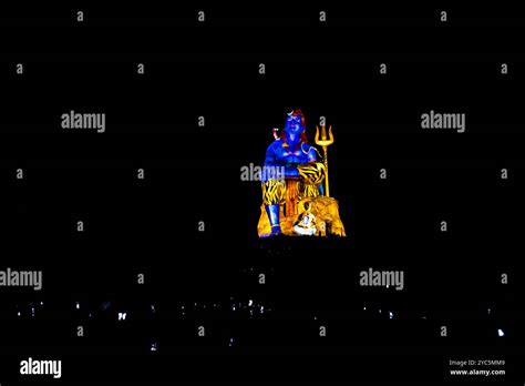 Statue Of Hindu Lord Shiva In Meditation Posture In Laser Light Effect