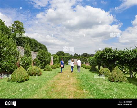 Tourists Walking In The Grounds Of The Historic Medieval Grounds Of