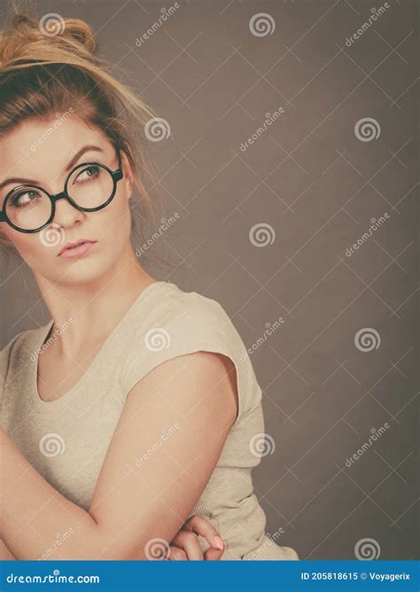 Grumpy Blonde Drinking Coffee Royalty Free Stock Photography