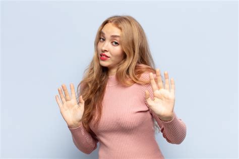 Premium Photo Blonde Woman Looking Nervous Anxious And Concerned Defensive