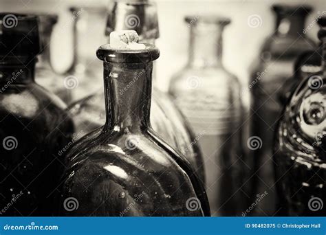 Coloured Glass Bottles On A Rustic Background Stock Image Image Of