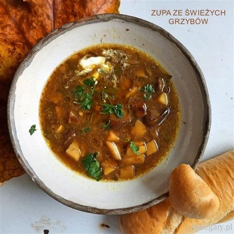 A Bowl Of Soup With Bread On The Side