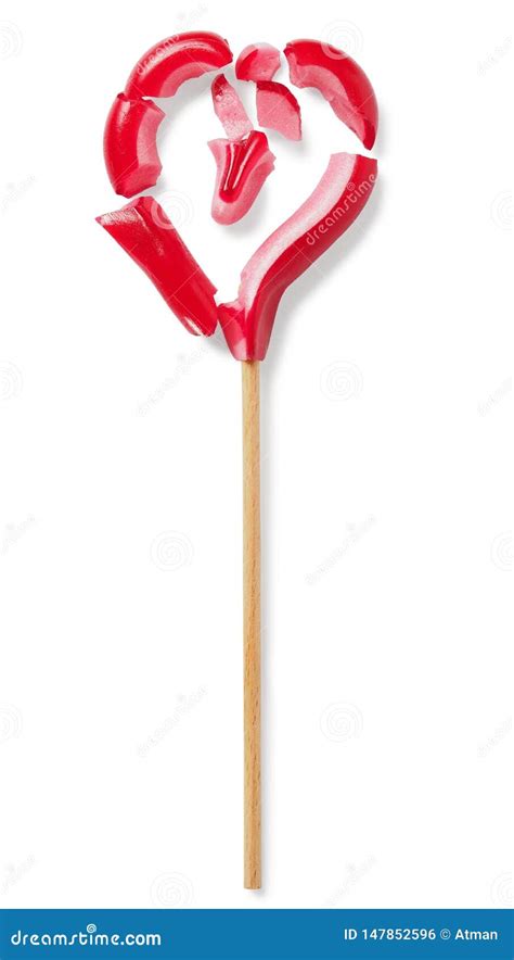 A Broken Lollipop On A Blue Background With A White Plastic Handle