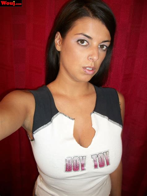 Good Looking Brunette Girl Teasing With Her Big Cleavage Photos