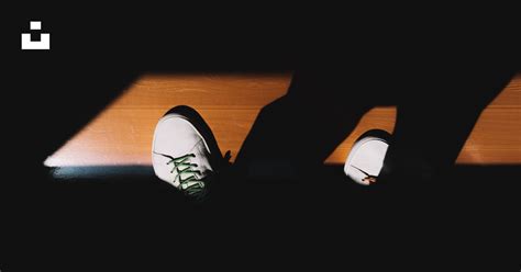 Person Wearing White Sneakers Photo Free Brown Image On Unsplash