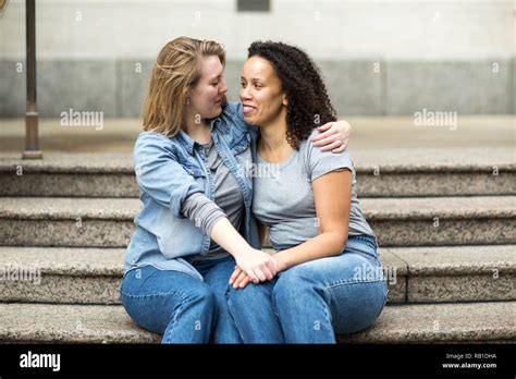 Happy Lesbian Couple Sitting Together Stock Photo Alamy