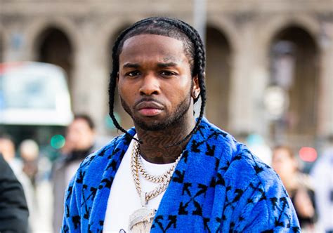 Rapper Pop Smoke Wearing A Blue Off White Coat Is Seen Outside The