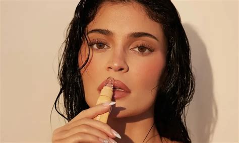 In A Tiny Orange Bikini Kylie Jenner Promotes A New Line Of Lip Butter BlackSportsOnline