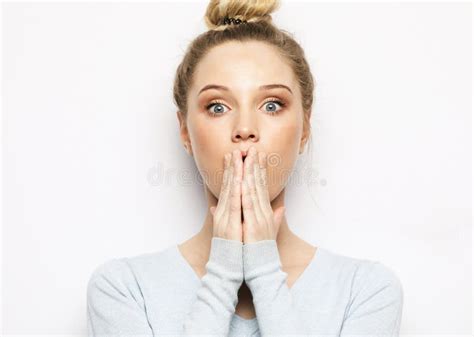 Shocked Blonde Woman Keeps Mouth Widely Opened Looks At Camera Wears Casual Clothes Stock