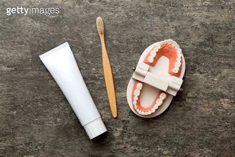 Mouthwash And Other Oral Hygiene Products On Colored Table Top View