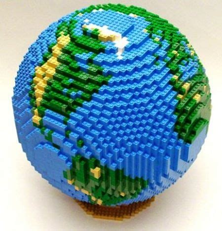 a lego model of the earth on top of a cupcake