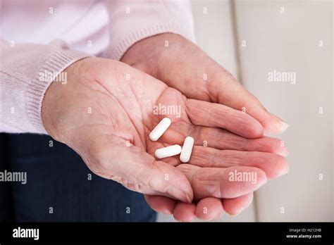 Close Up Of Hand Holding Medicine Stock Photo Alamy