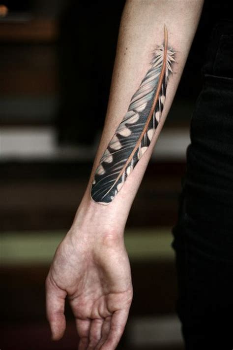 Feather Tattoo On Arm By Alice Kendall