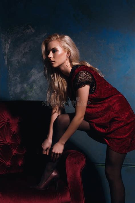 Beautiful Blonde Girl Posing With A Chair In A Dress Stock Image Image Of Blonde Modern 83823217