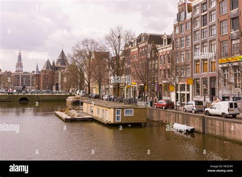 AMSTERDAM, NETHERLANDS - Houseboat on canal Stock Photo - Alamy