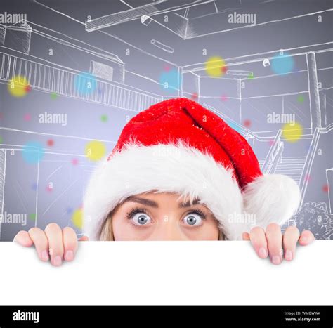 Festive Blonde Showing Large Poster Against Grey Vignette Stock Photo