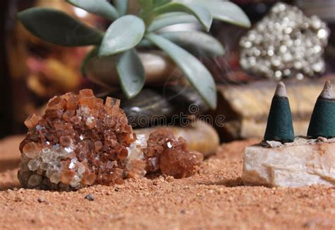 Aragonite Crystals With Incense Cones On Australian Red Sand Stock