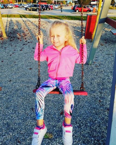 Premium Photo Portrait Of Cute Girl On Swing In Playground