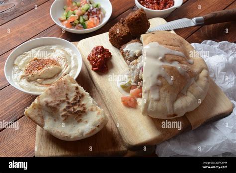 Falafel In Pita Bread With Vegetable Salad Harissa Sauce Humus