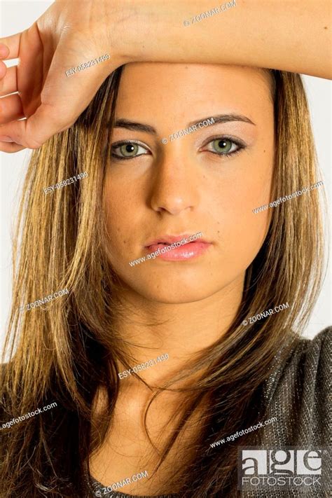 Gorgeous Long Haired Brunette Model Posing Against A White Background Stock Photo Picture And