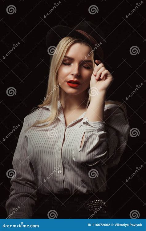 Amazing Blonde Girl In Glasses And Hat Posing With Dramatic Li Stock
