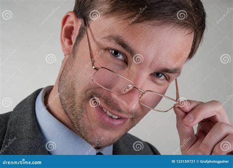 Cute Businessman In Glasses Smiles And Looks At Camera Stock Image