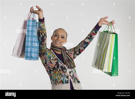Gay Man Carrying Shopping Bags And Smiling Stock Photo Alamy