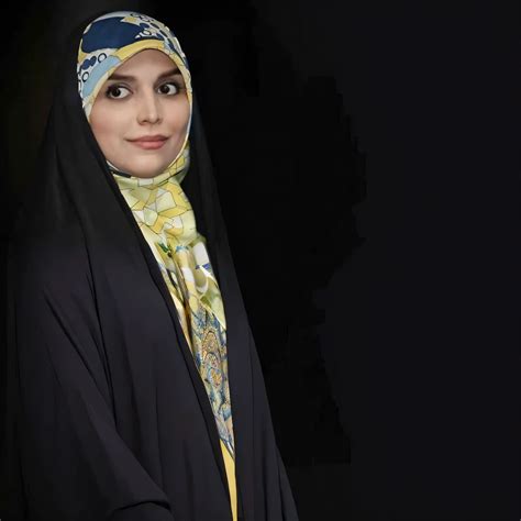 A close up of a woman wearing a black hijab and a scarf - SeaArt AI