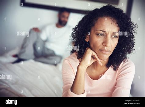 Is It Worth The Fight Anymore A Mature Woman Looking Upset With Her Husband In The Background