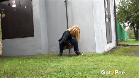 Cute Blonde Pisses Next To A Busy Road
