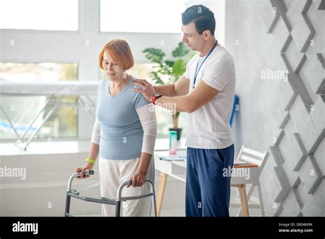professional young doctor standing   patient stock photo alamy