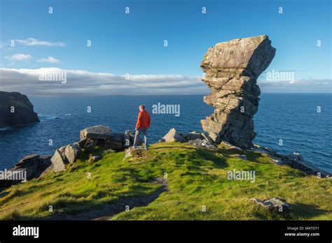 Hiker And Rock Formation At Hags Head Cliffs Of Moher Coastal Walk