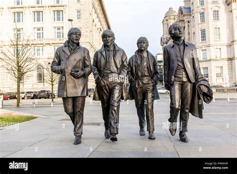 The Beatles Statues At The Pier Head In Liverpool Uk With The Royal