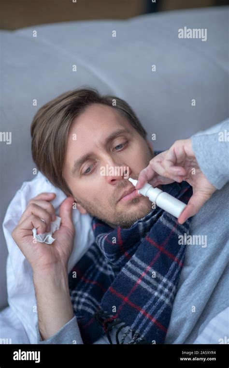 Top View Of Sick Exhausted Man Using Nasal Spray Stock Photo Alamy